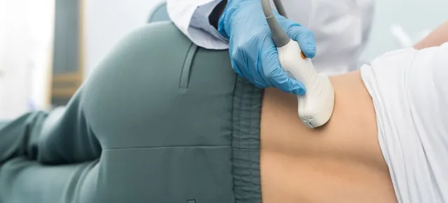 An ultrasound probe on the lower back